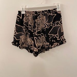 Black and cream colored ruffle shorts